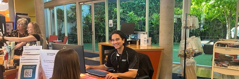 Image of Noosa Council staff speaking to a customer at Cooroy Library