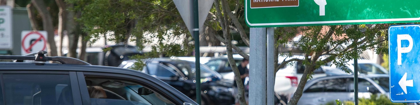 Image of a person driving a car into a car park in Noosa