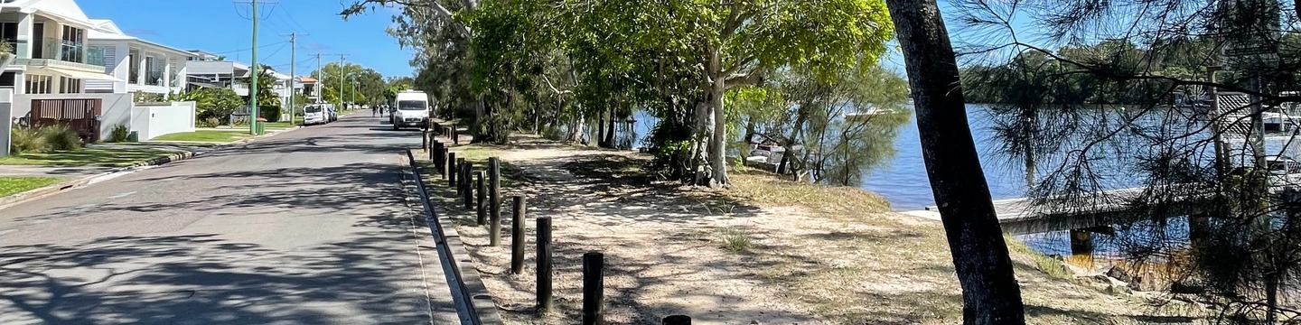 Image of Hilton Esplanade including road, seat and water frontage