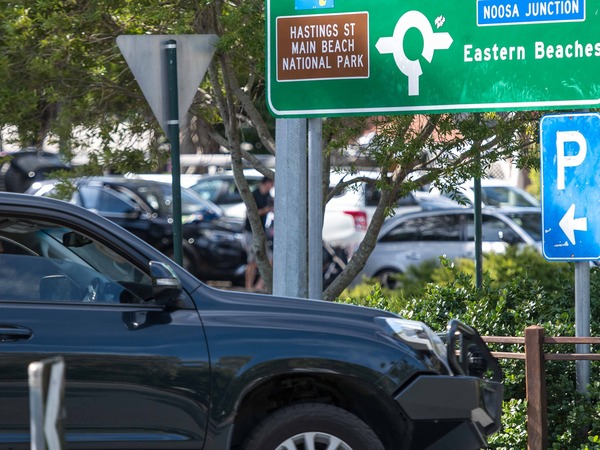 Image of a person driving a car into a car park in Noosa
