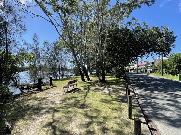 Image of Hilton Esplanade including road, seat and water frontage